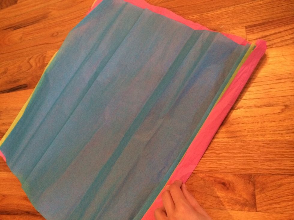 Stack all of your sheets of tissue paper on top of each other. You can use any colors you want!