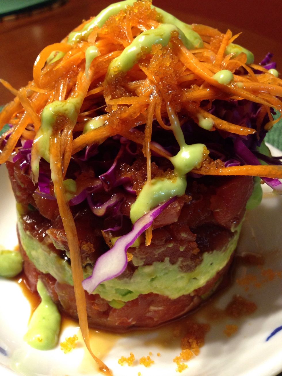 Stack cabbage; carrots massago and more sauce. Drizzle wasabi on top
