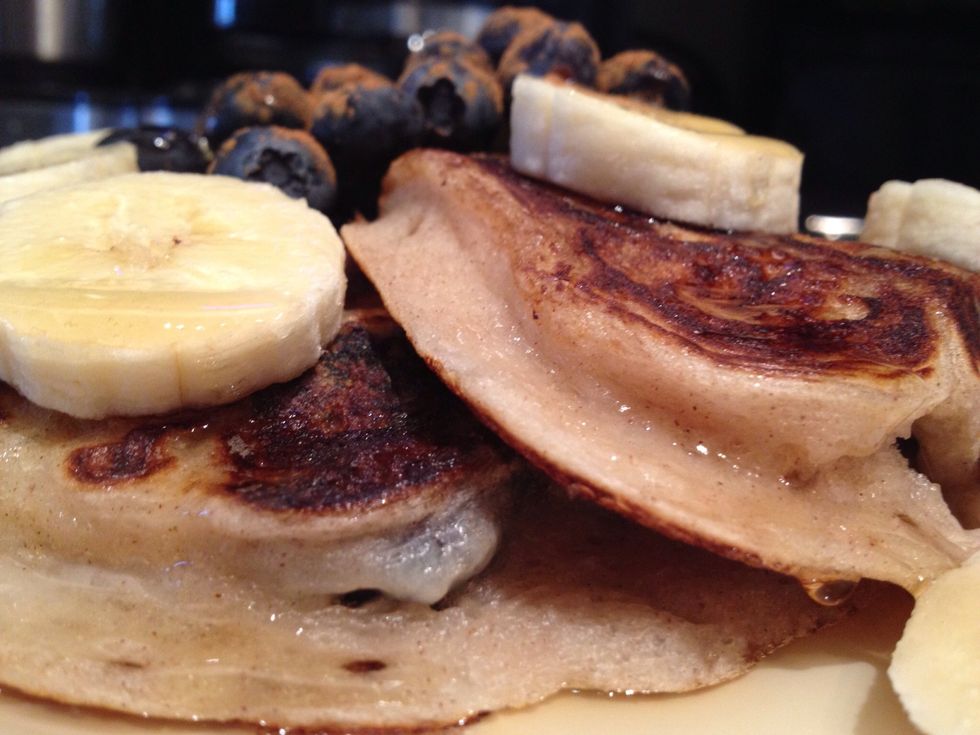 Stack em up, and serve with whatever you want: I added a banana, some more blueberries, and maple syrup + cinnamon. You can add confectioners sugar, butter, whipped cream...etc...