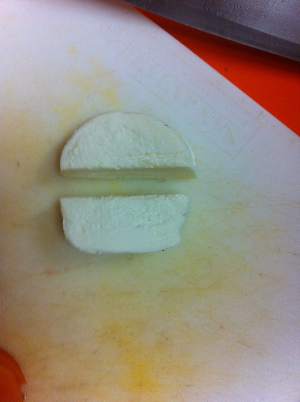 Stack mozzarella slices an slice in half.