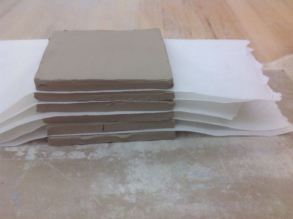 Stack pieces with paper in between them. Allow pieces to become leather hard before building.