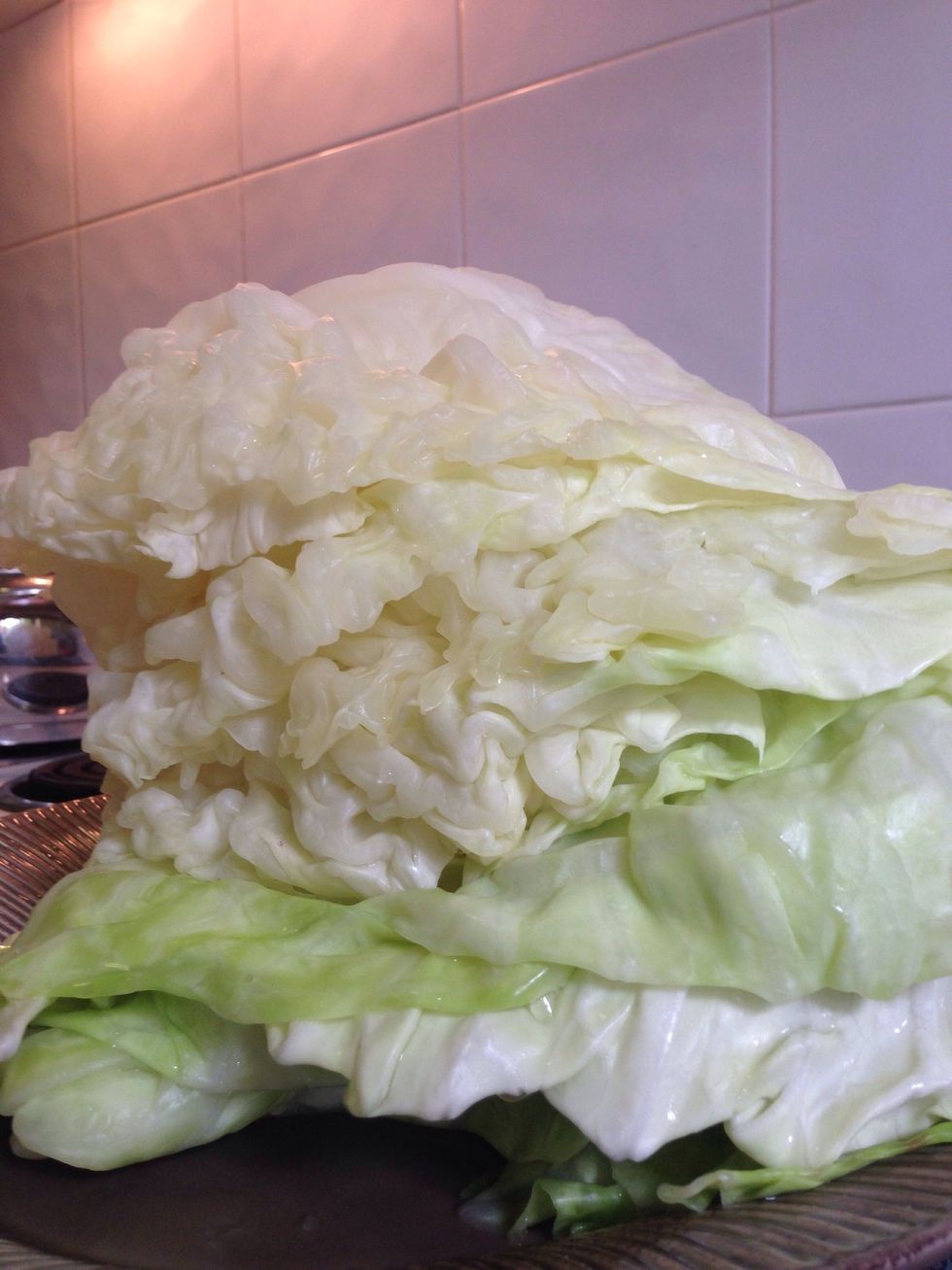 Stack prepared cabbage leaves on top of each other and place to the side for now.