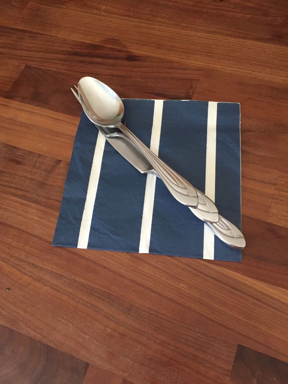 Stack silverware on top of each other on the napkin diagonally!
