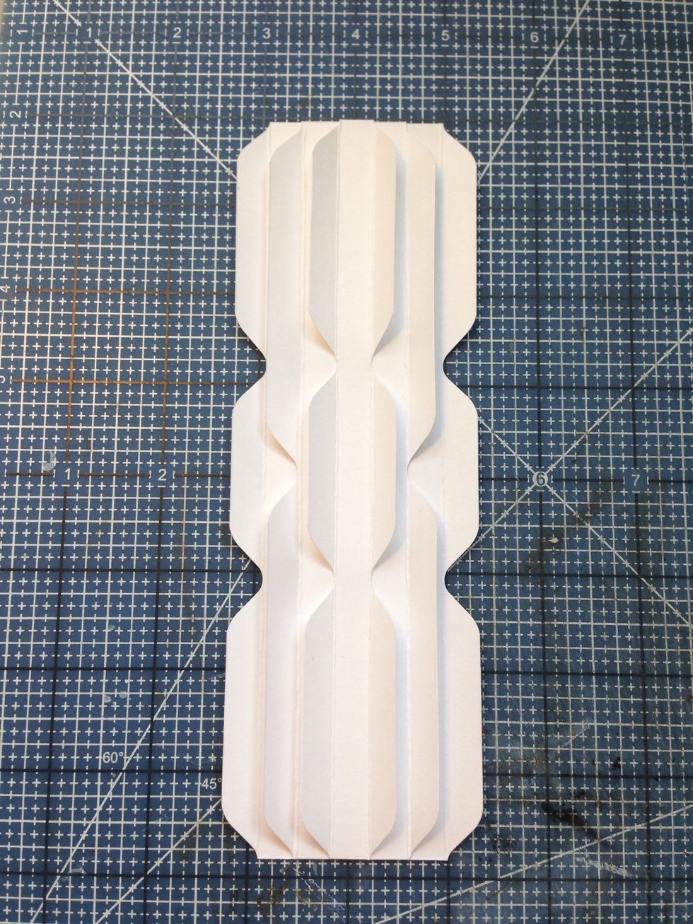 Stack the binding strips in ascending order as shown....Stack the Deck! Attach with strong adhesive or glue.