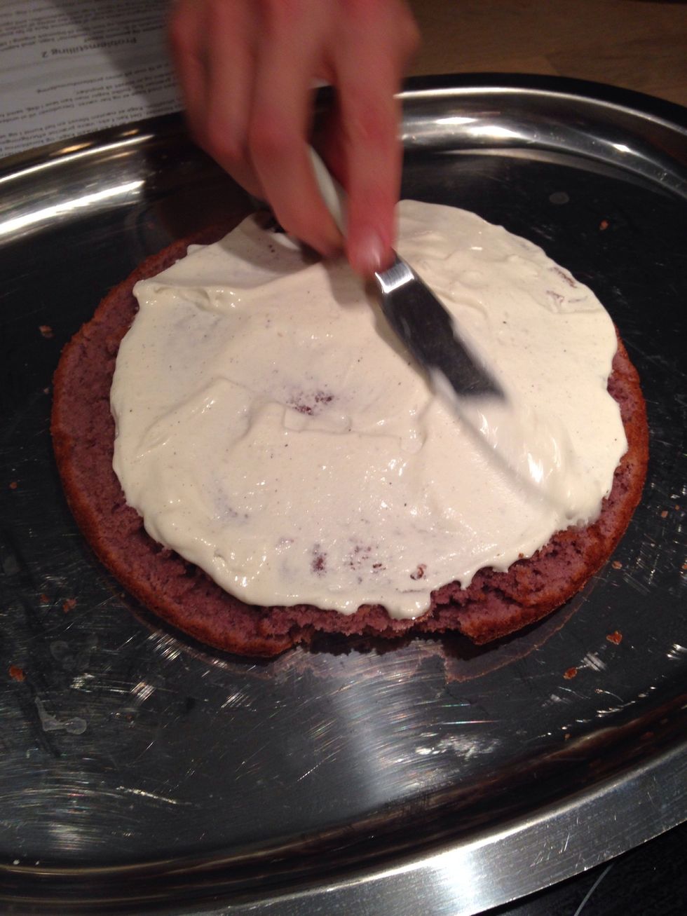 Stack the cakes with frosting or whiped cream . Purple cake first - then blue - then green - then yellow - then orange - then red (like a rainbow)