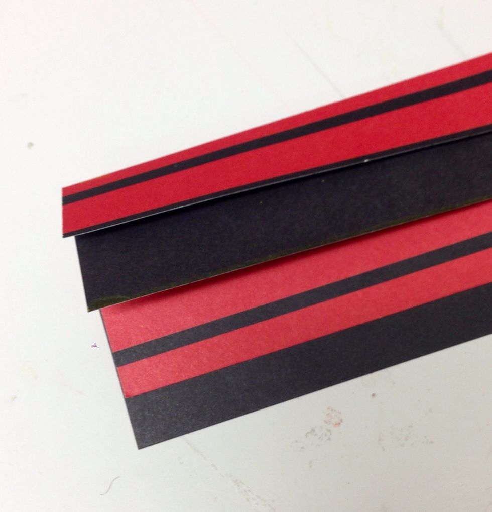 Stack the strips so they form an overlapping cascade of flaps.