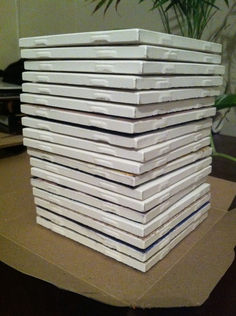 Stack the tiles on top of each other to apply pressure to the felt and rubber cement for a good stick! (I had extra tiles for other projects that I used as added weight.)