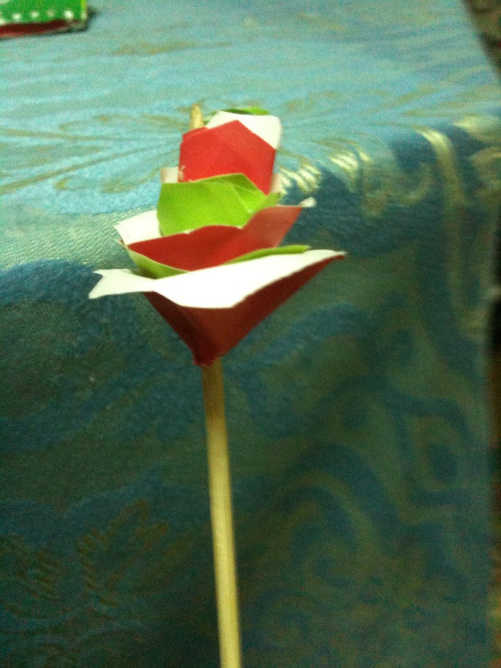 Stack them according to their sizes and pierce them with the stick