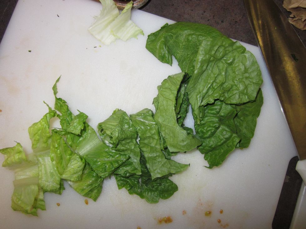 Stack together 6-8 romaine lettuce leaves and chop into strips