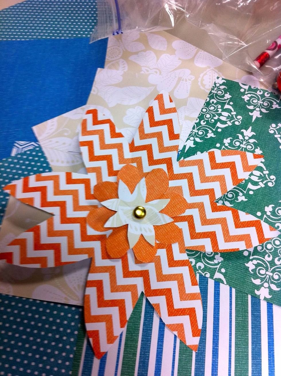 Stack your flower petals large, medium, then small, and push the brad through the center (or glue them together). Voila!