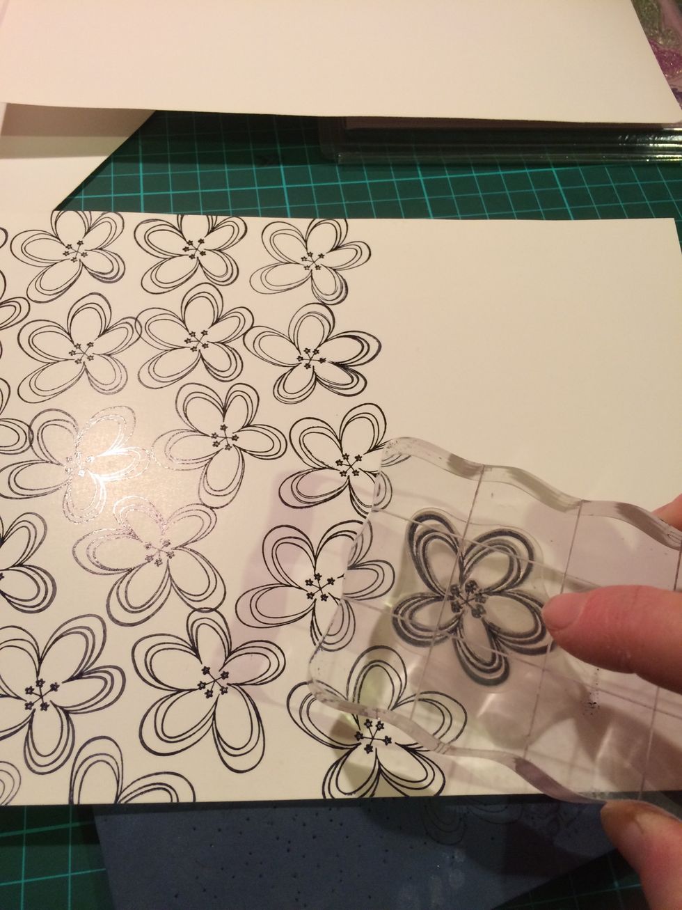 Stamp a piece of cardstock with a stamp that will be good to colour in. Remember to go off the edges with the stamp.