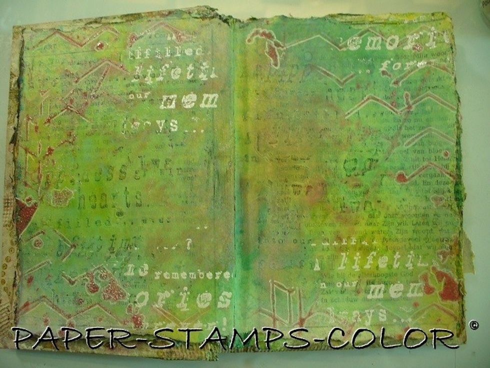 Stamp a script partially on several parts of the pages and heat emboss in white.