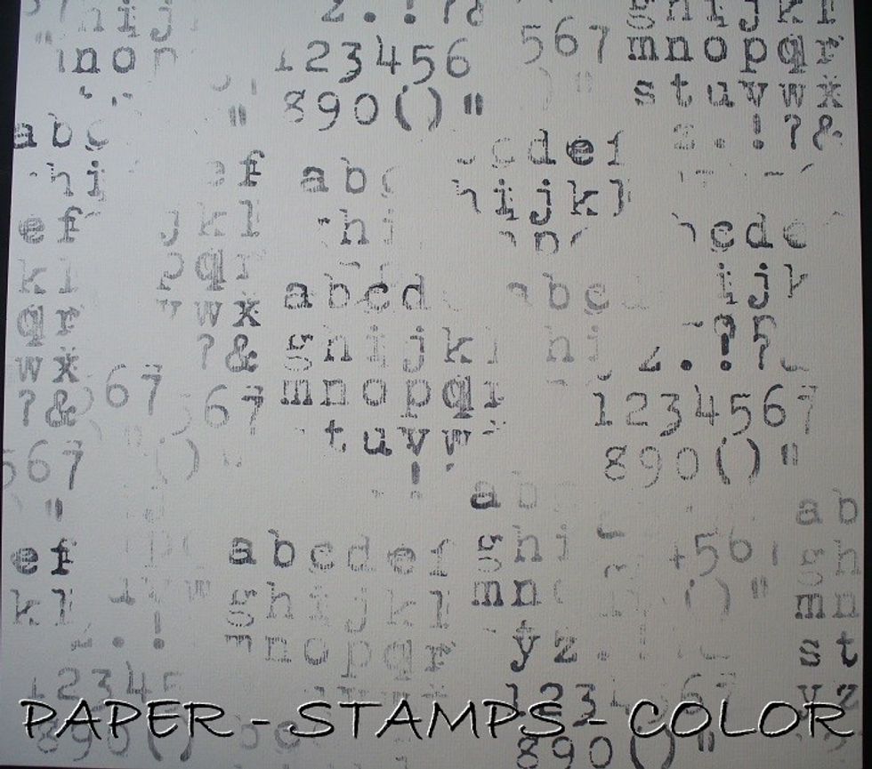 Stamp a script randomly onto a 12x12 inches white basic scrapbookpaper. Don't try to fill it all up, and don't stamp the whole stamp at a time.