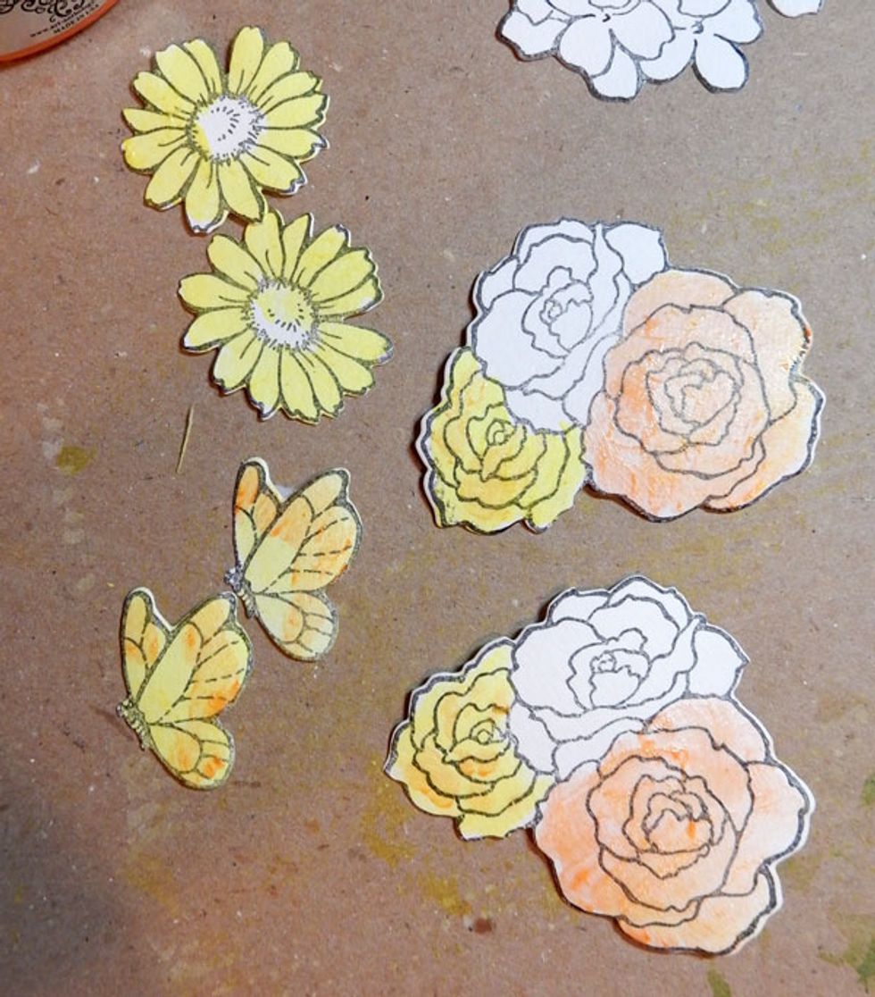 Stamp and die cut flowers and butterflies.  Paint the roses with Lemon Tart, Tiger's Eye, Just Peachy, Cotton Candy and Persimmon. Paint butterflies and daisies with Lemon Tart and Tiger's Eye.