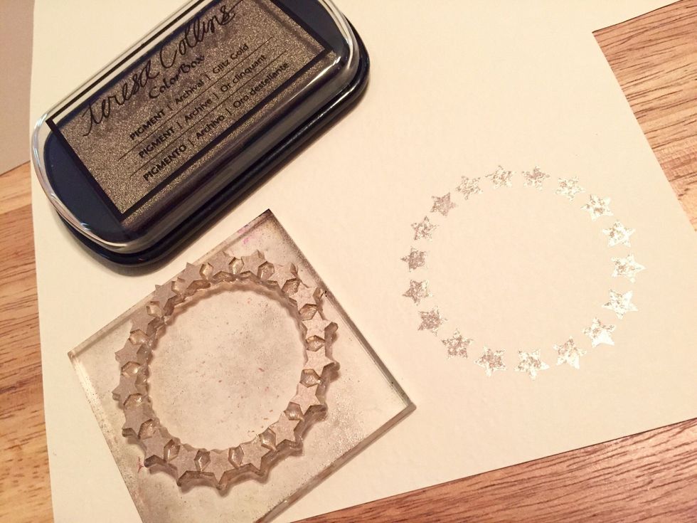 stamp circle of stars using Glitz Gold Ink onto cream cardstock. remember to HEAT SET inks after each step!