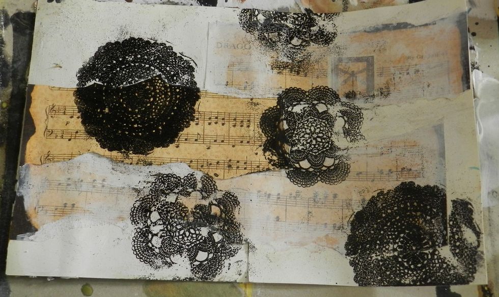 Stamp doilies and add black embossing powder on the stamps. Use a heat tool.