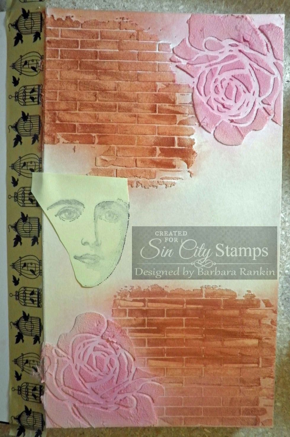 Stamp face onto post it note and cut around image to make another mask. Place over stamped face on journal page. This will protect face image in next step.