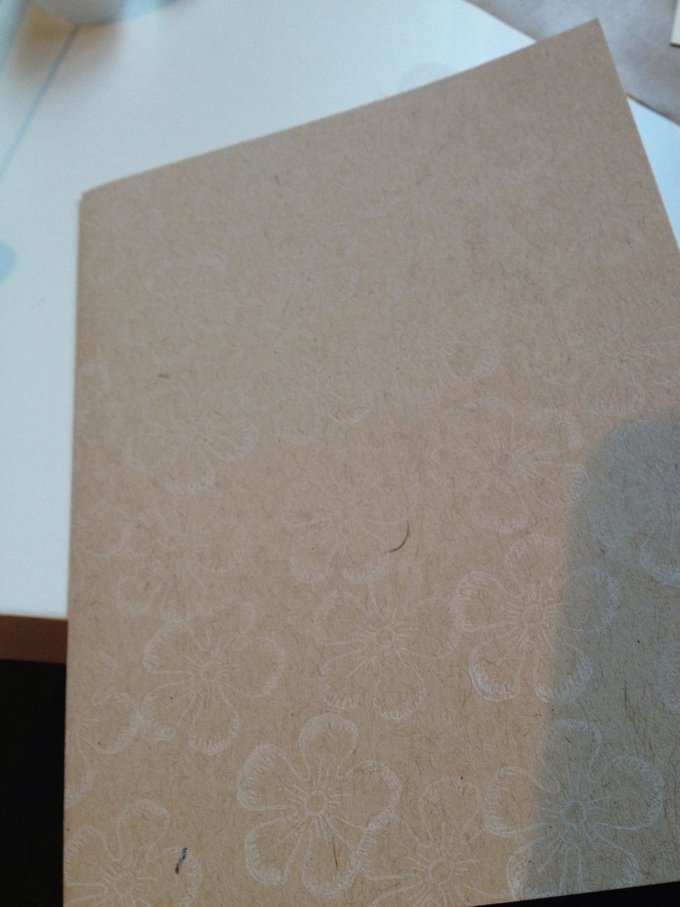 Stamp flowers in white ink on the craft card stock. This is a background so they can go off the edge or be orientated however you like; have fun with it.