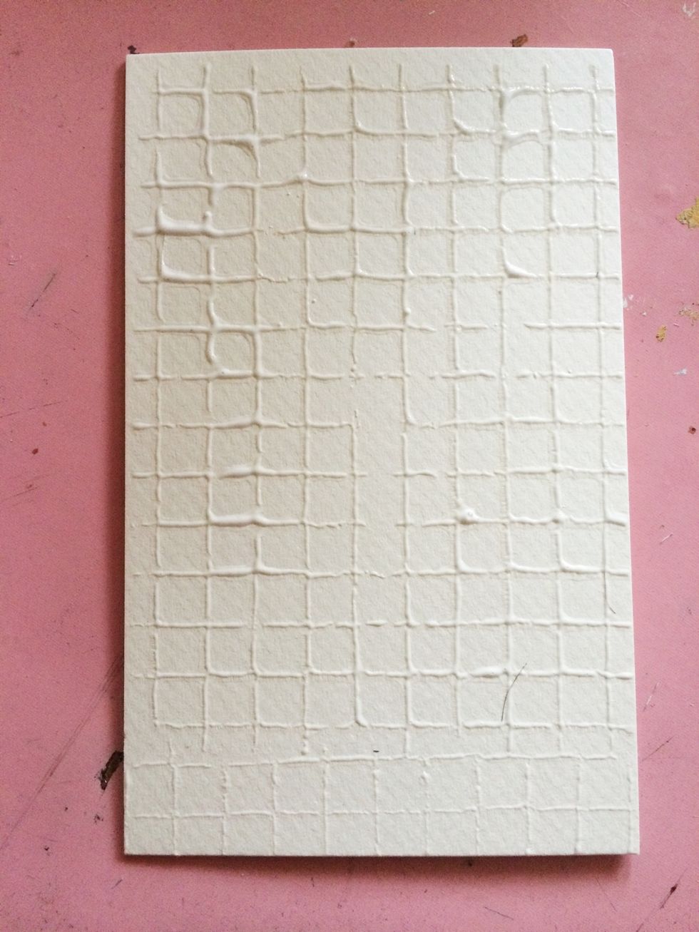 Stamp onto your matte board. Use light pressure to keep your stamp from sliding. Repaint and restamp if necessary to fill any bear spots. Clean you stamp before the gesso has time to dry.