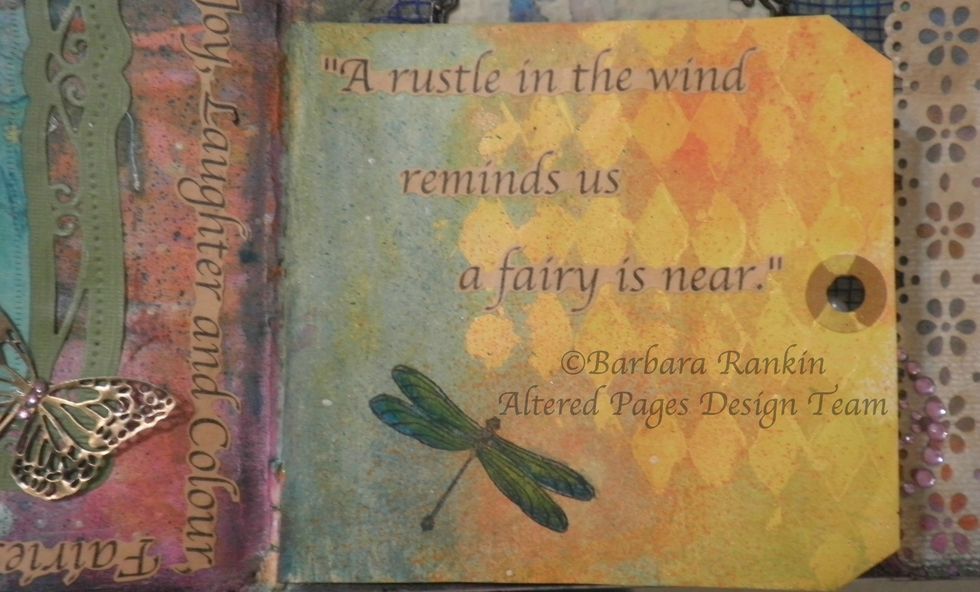 Stamp small dragonfly on each side of tag with Black StazOn ink. Color wings with DecoArt Cerulean Blue and Yellow Green Mister. Fussy cut fairy quote and adhere.
