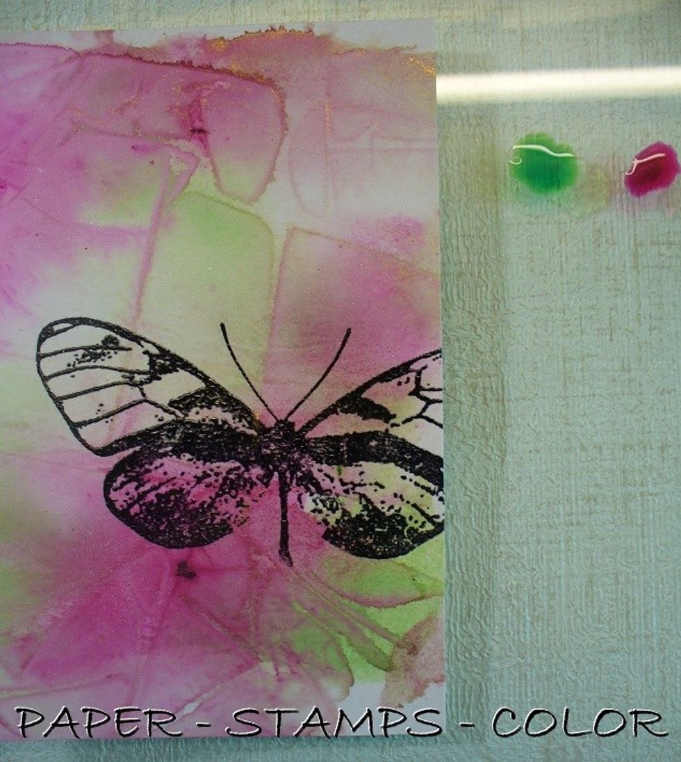 Stamp the butterfly from Stampendous with black archival ink and heat emboss with clear embossing powder. Color the butterfly with the MInx inks as shown.