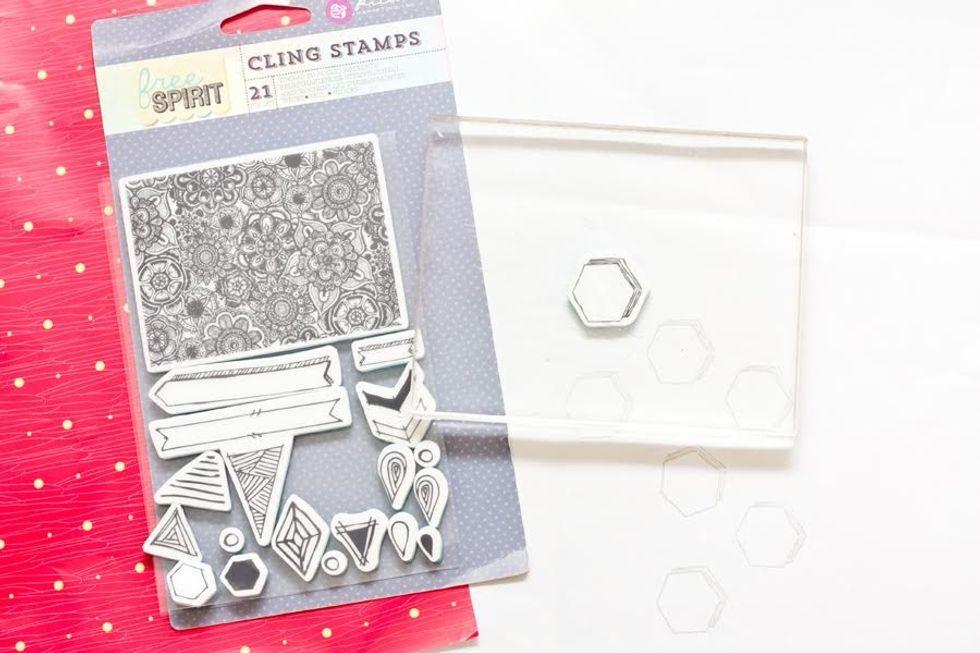 Stamp the Free Spirit cling stamp hexagon image onto the inside/white part of the gift wrapping.