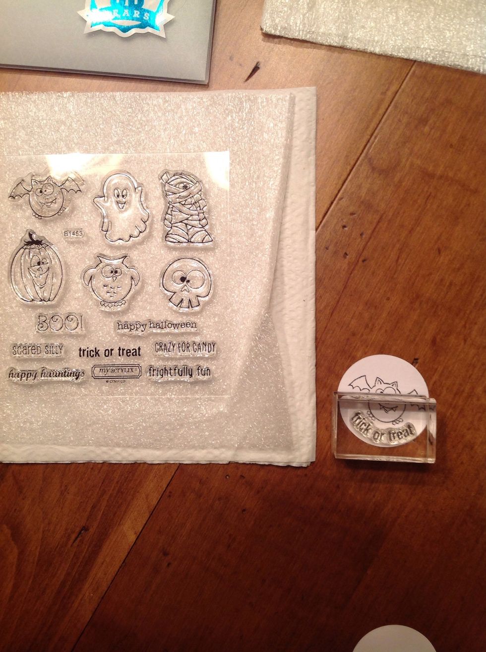 Stamp the image on the small circles included in your kit! I took the trick or treat stamp, and mounted it on the block in a curve shape to match the circle! I love the flexibility of our stamps