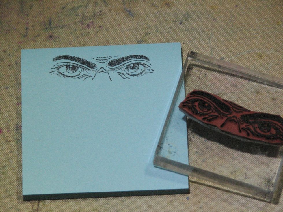 Stamp the spooky eyes on a Post it Note and trim.  This will become the mask while we apply the paint and PanPastels.