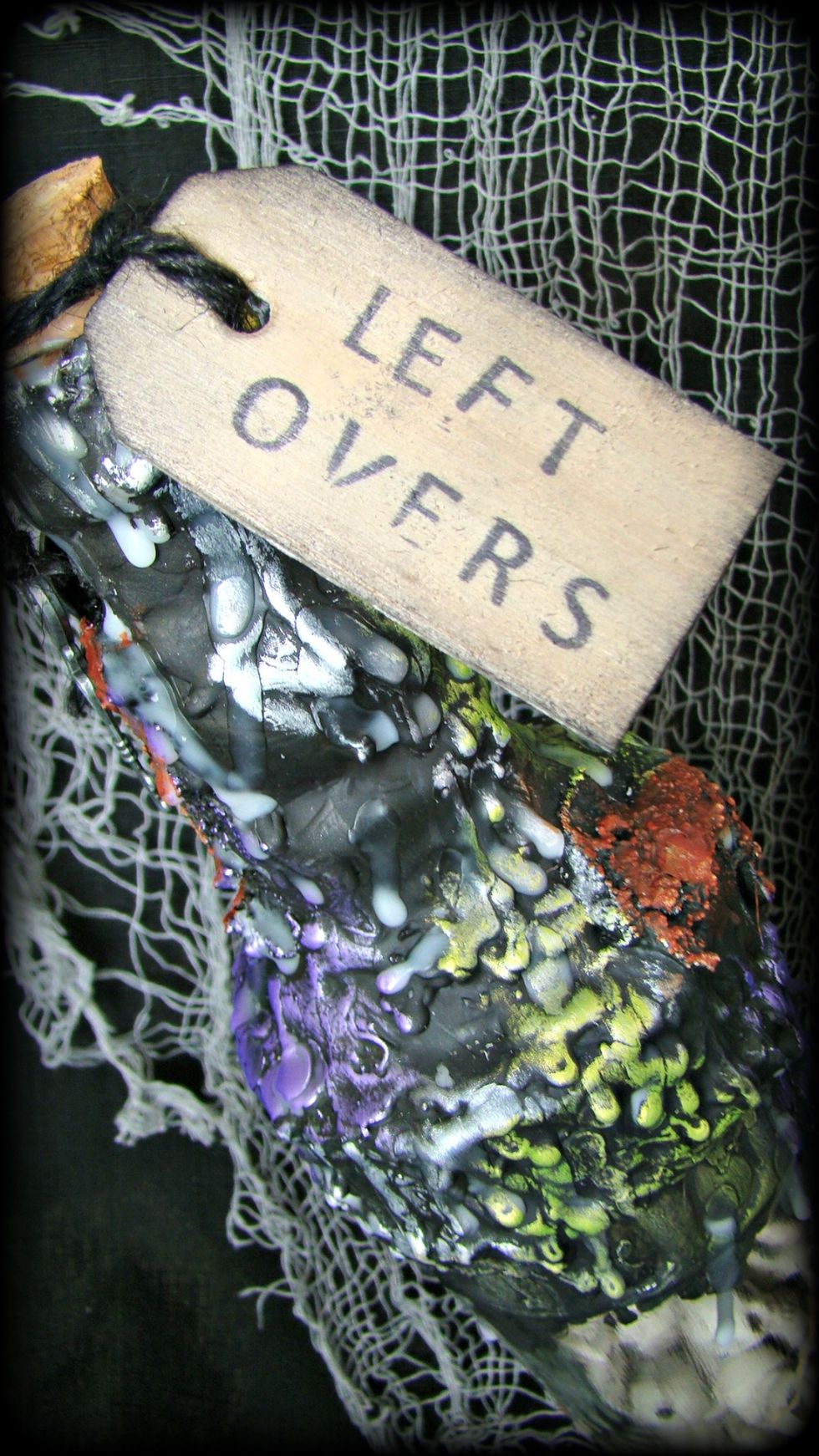 Stamp your message on your wooden tag and distress the edges with DI in Black Soot. Attach with black twine, not pictured are also metal keys that are attached, they are on the other side of bottle.
