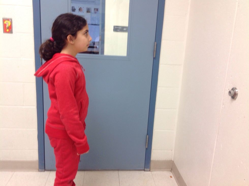 Stand 2 feet away from the wall and have the mat in front of you.