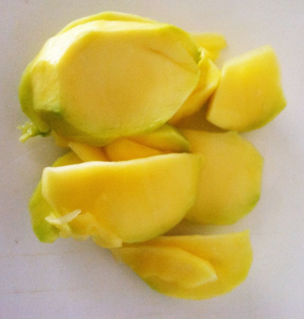 Stand fruit on the stem end and carefully slice downward towards cutting board.