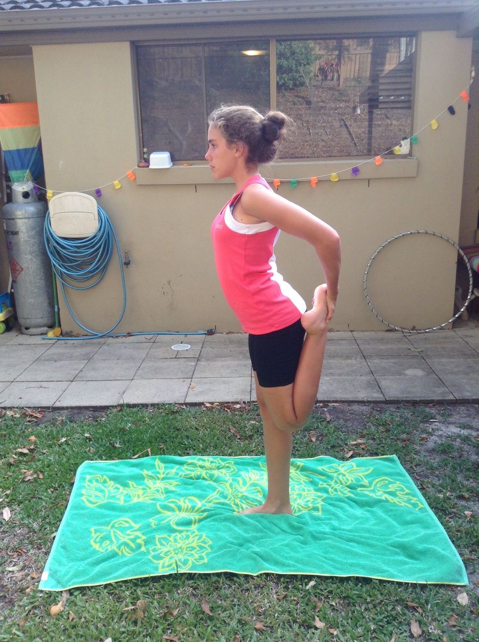 Stand on one foot and lift the other foot up to your bum. Hold for 15 seconds.