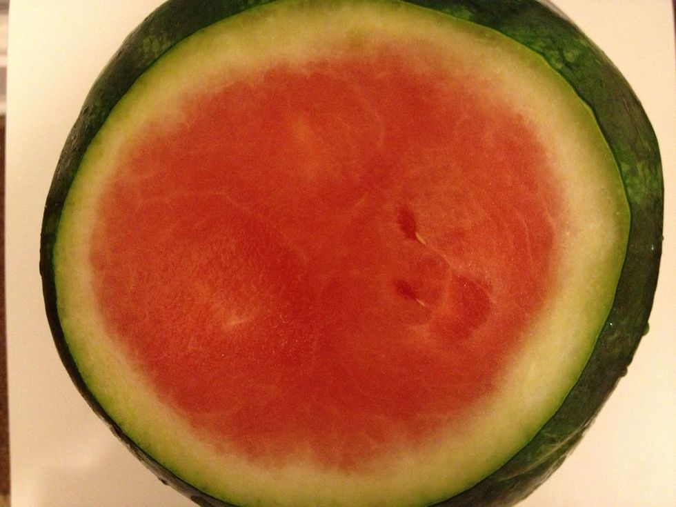 Stand the watermelon in an appropriately sized bowl.