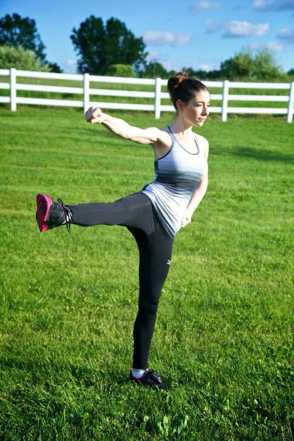 STANDING LEG LIFT: Lift the right leg while bringing the right arm down towards the leg. Be sure to keep your knee and chest facing forward. Hold, then return to starting. Complete 12 per side.