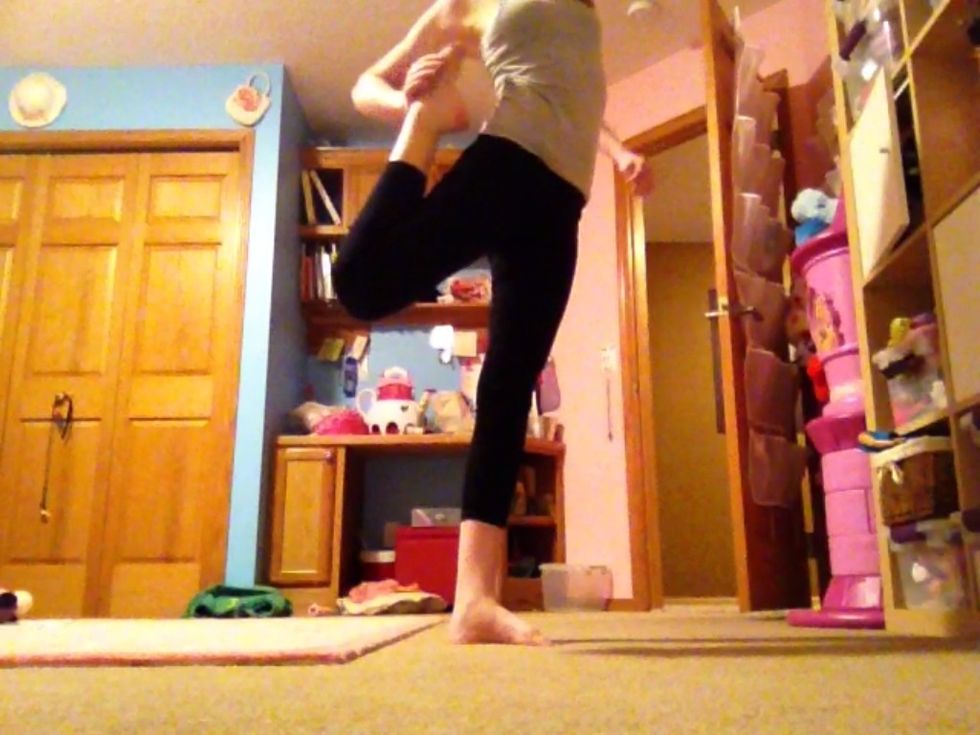 Standing quad: Stand on one foot and grab the other with one hand. Push your foot against your lower back.