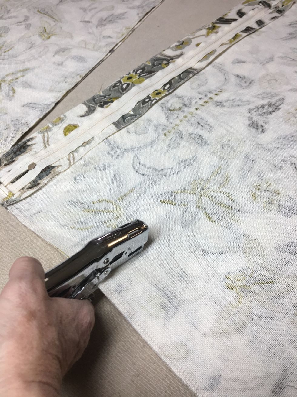 Staple pillow fronts to back on all 4 sides.  TIP: We prefer to use a clipper stapler rather than pins.  They hold the fabrics more securely without the risk of them coming out or your getting stuck