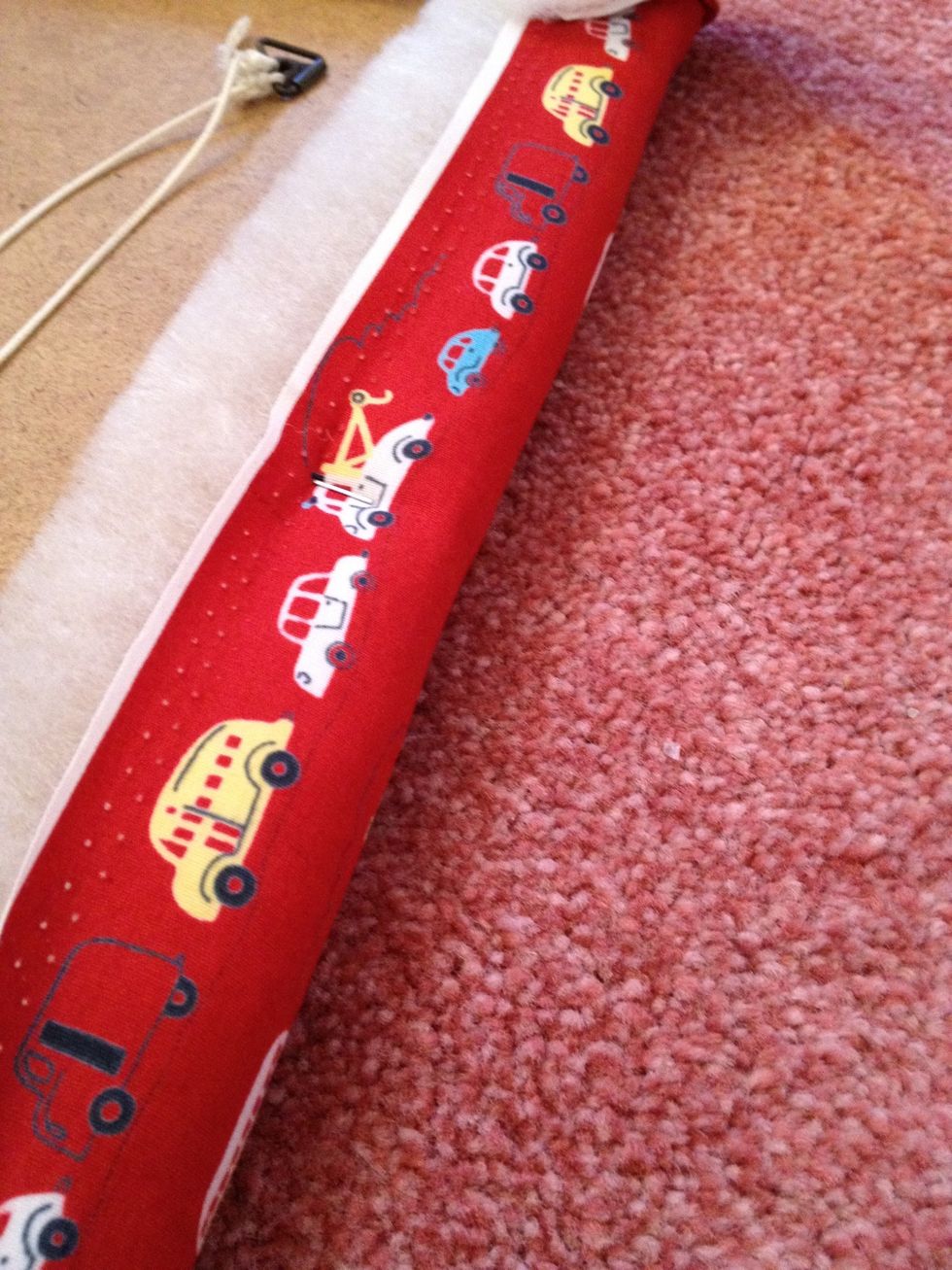 Staple the bottom of your fabric to the frame first then the top and keep tight. Finally finish with the sides.