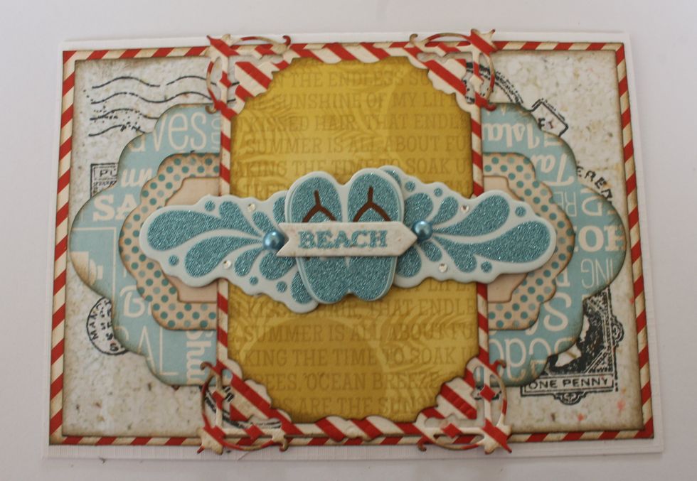 Staple the chipboard pieces on top of each other and add two pearls to the chipboard waves.