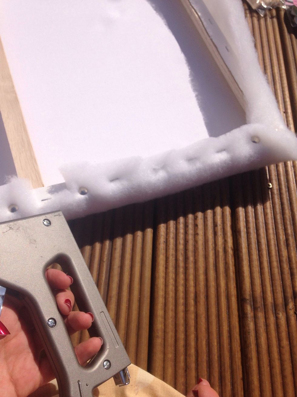 Staple the whole way around each edge of the canvas.