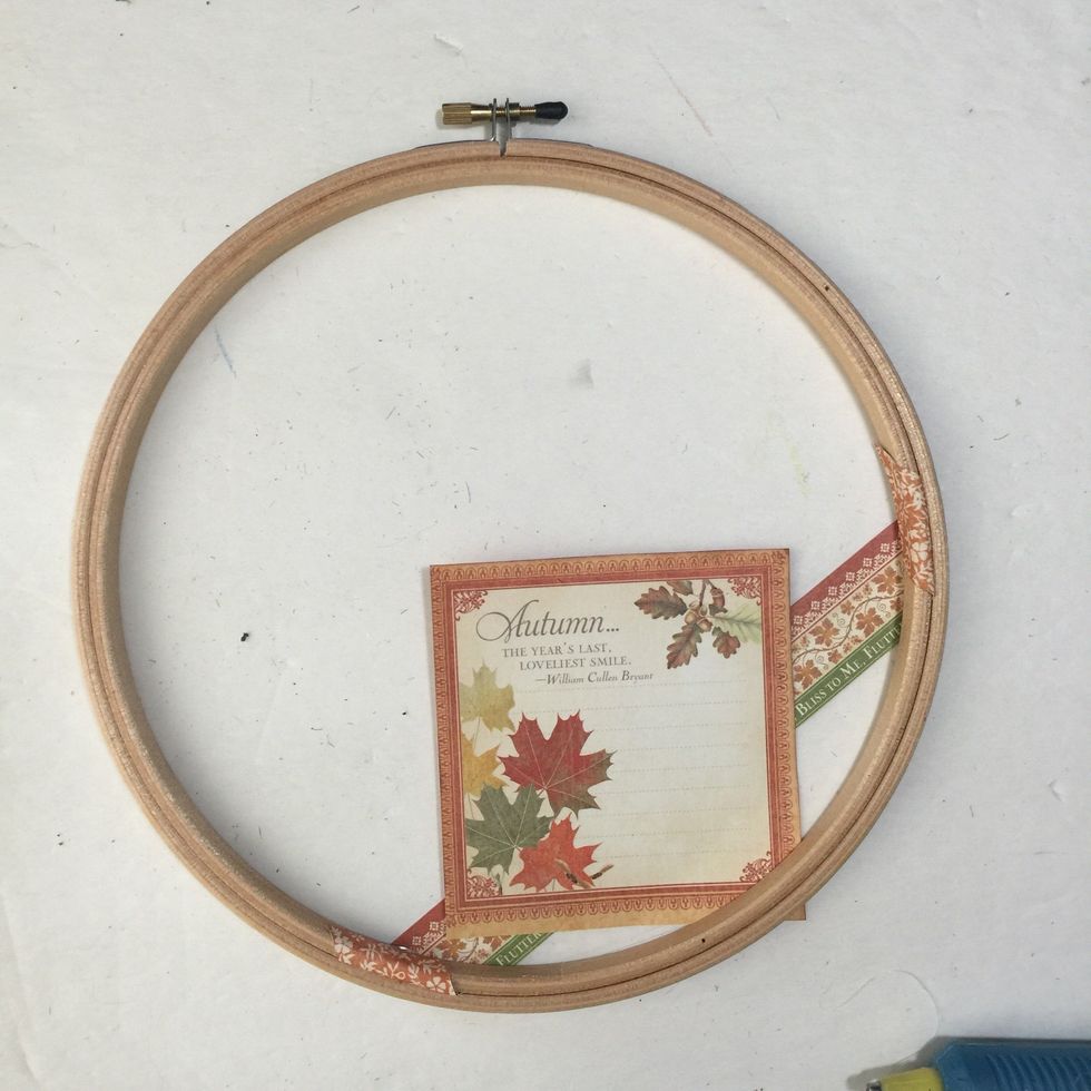 Start adding desired cut a parts to wreath. Gluing it to the burlap or the paper strip, whichever you have decided to use. Use foam dimensional squares to layer and add depth.