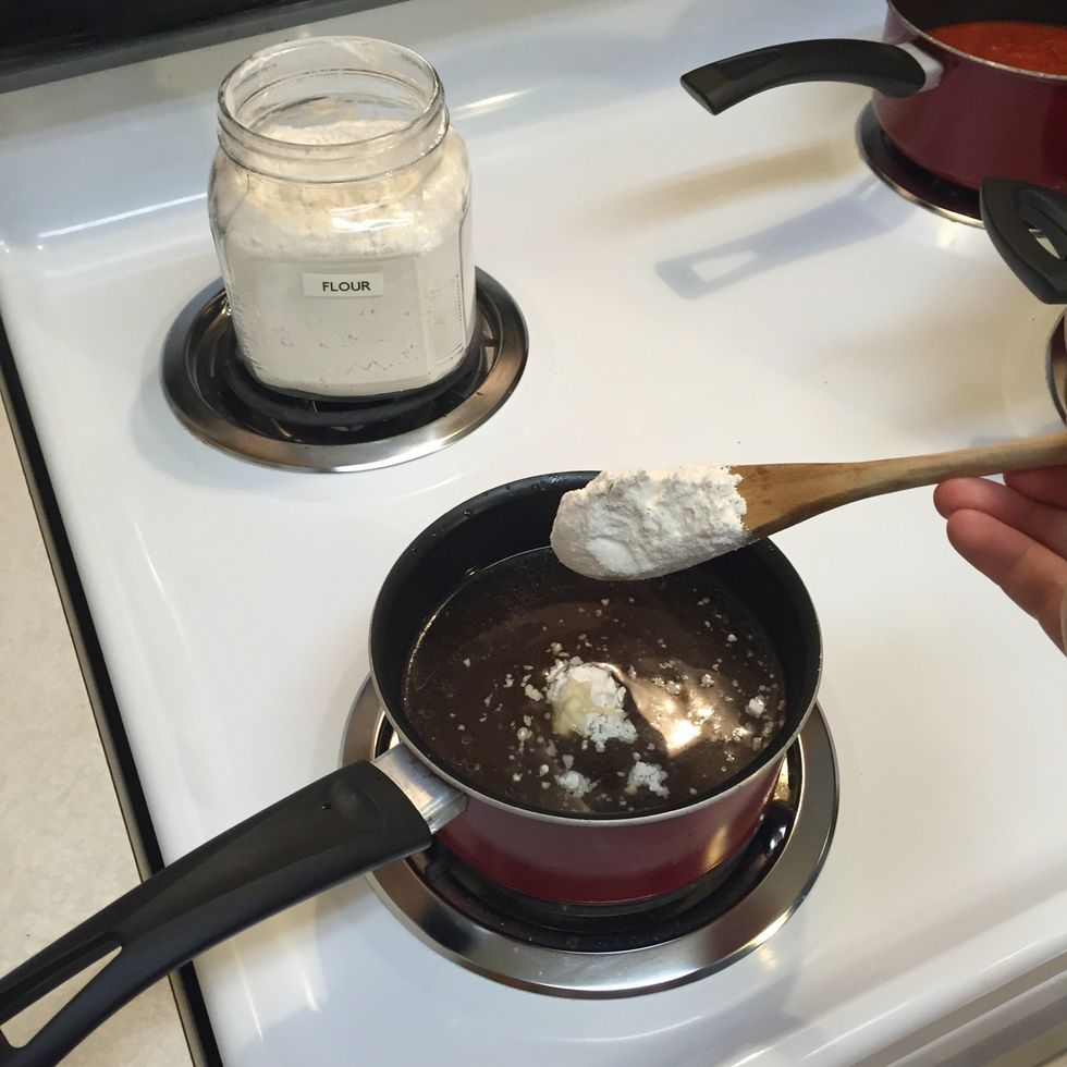Start adding flour slowly. The amount of flour will effect the thickness of your gravy. Give it some time to heat and thicken before adding more