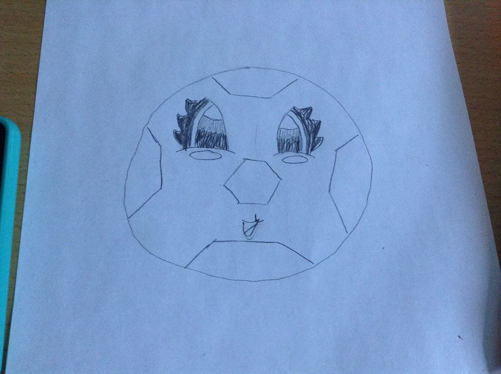Start adding the hexagons in the circle but live some room for the mouth