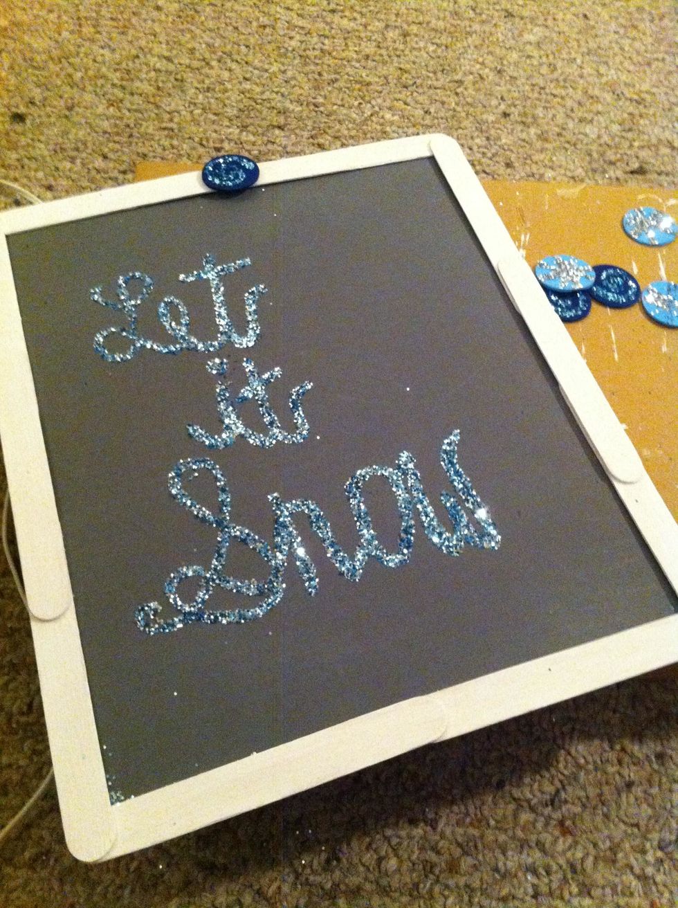 Start adding your wood shape accents to the frame of your sign.