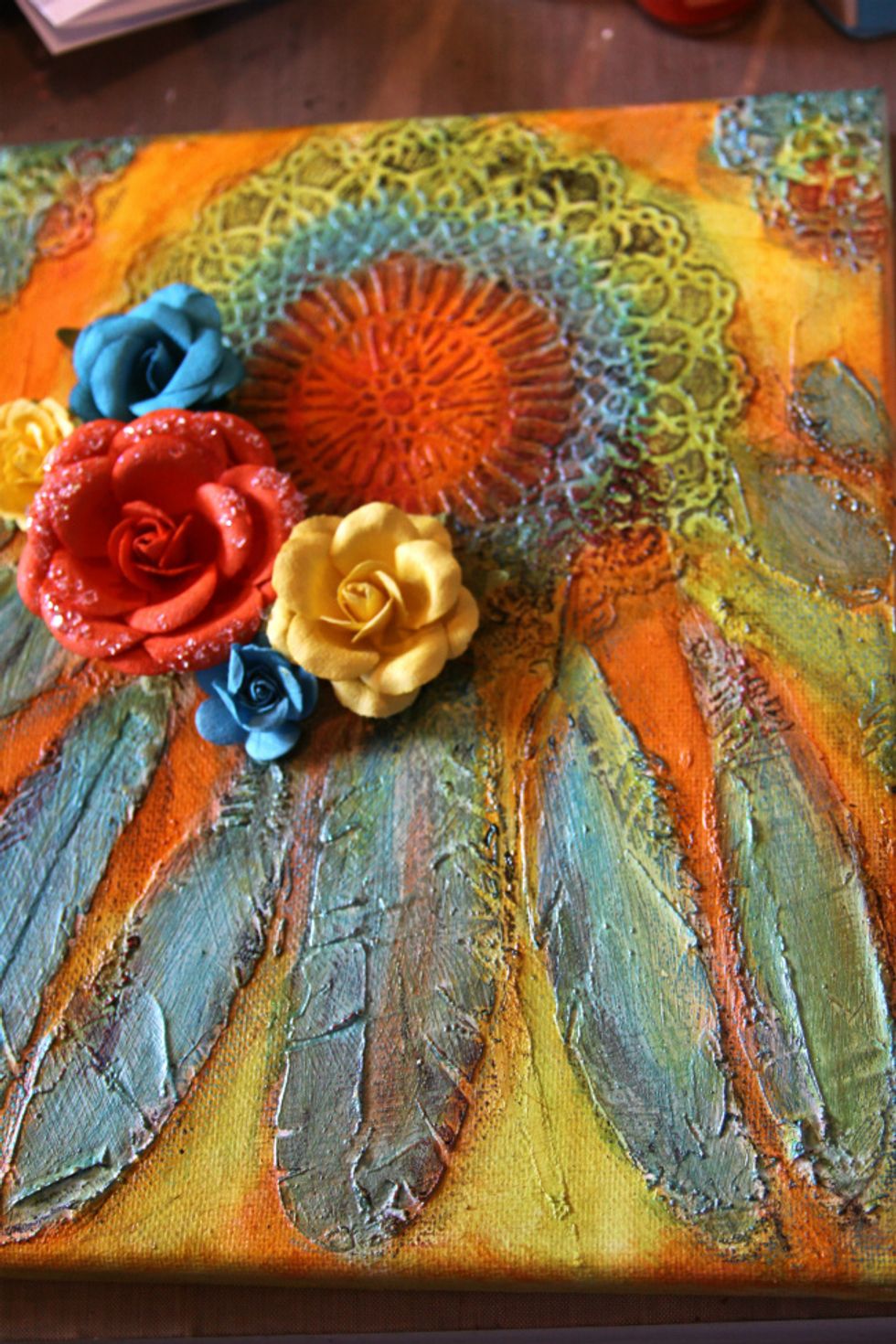 Start adhering your embellishments