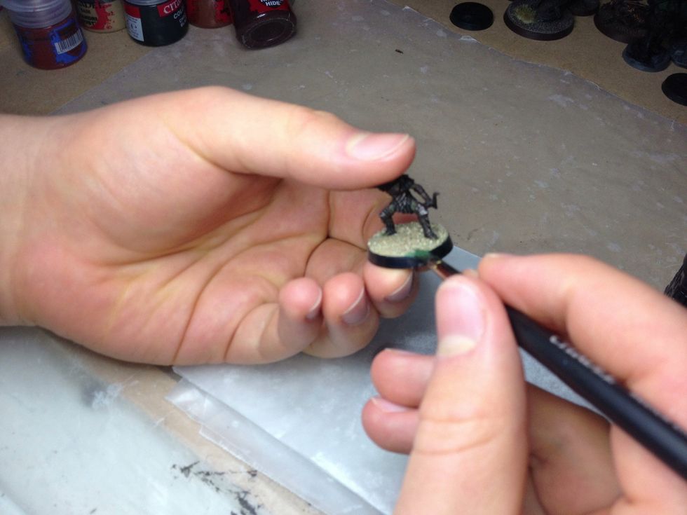 Start applying the mixture to the edge of where you glued the sand. It will start to seep under the terrain. When done right, this will help to keep the sand from peeling.