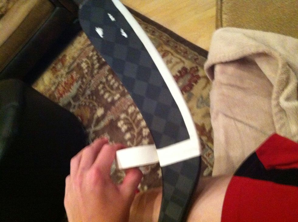 Start at the heal of the stick and wrap the tape around the top.