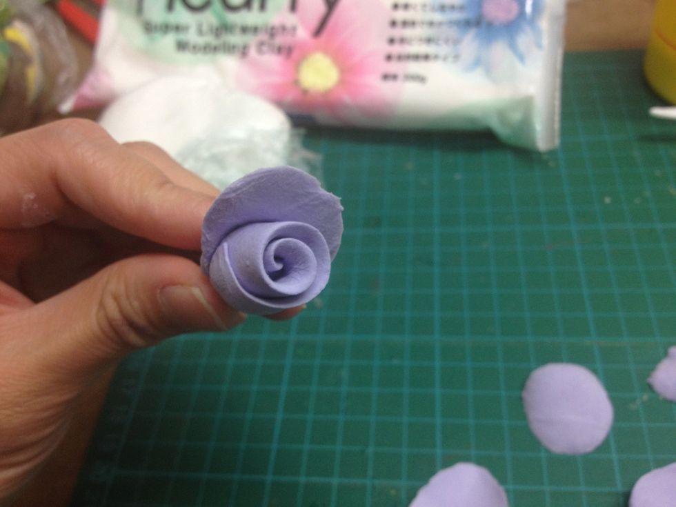 - Start attaching the petals around the rose.