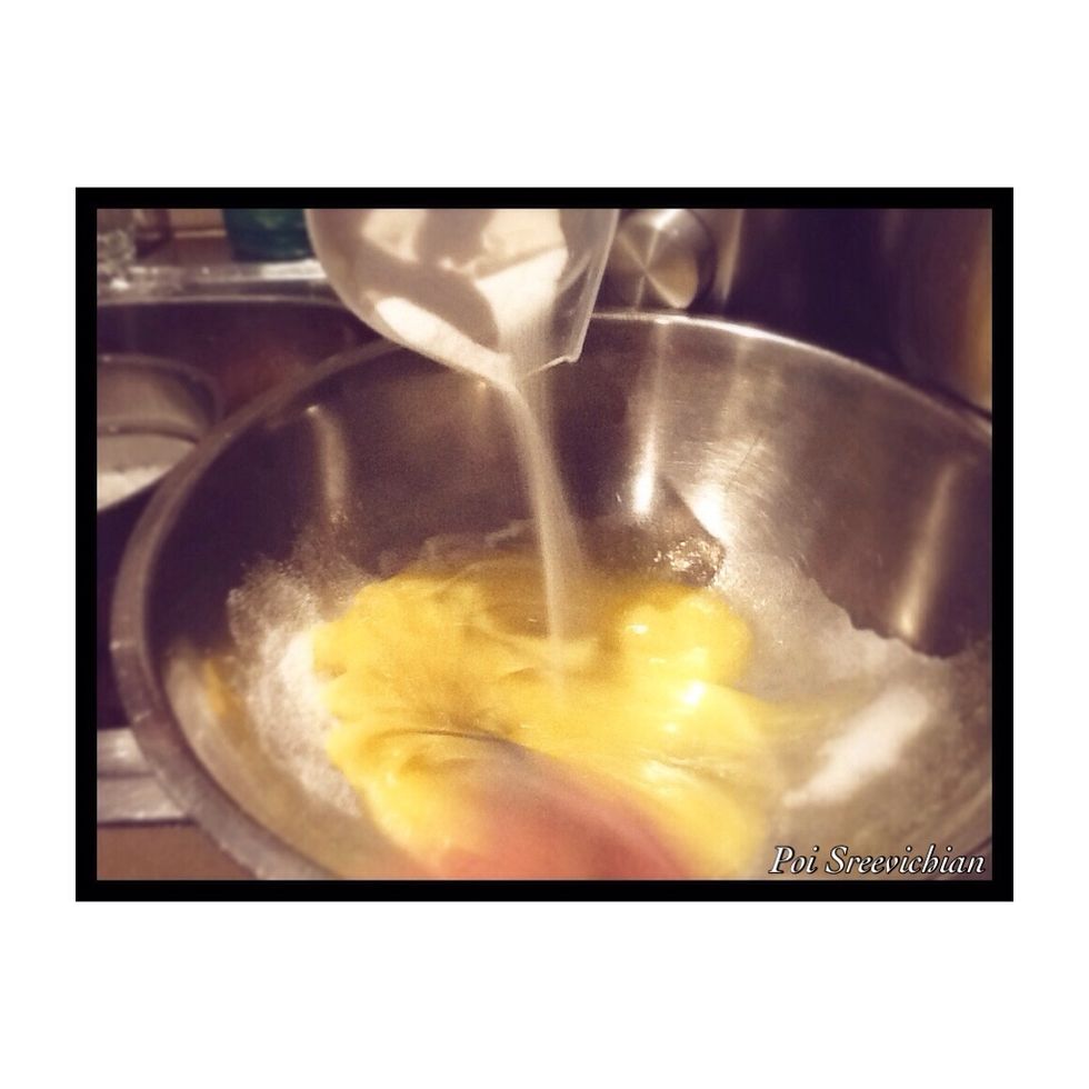 Start beating the eggs then slowly at the same time pour the sugar in