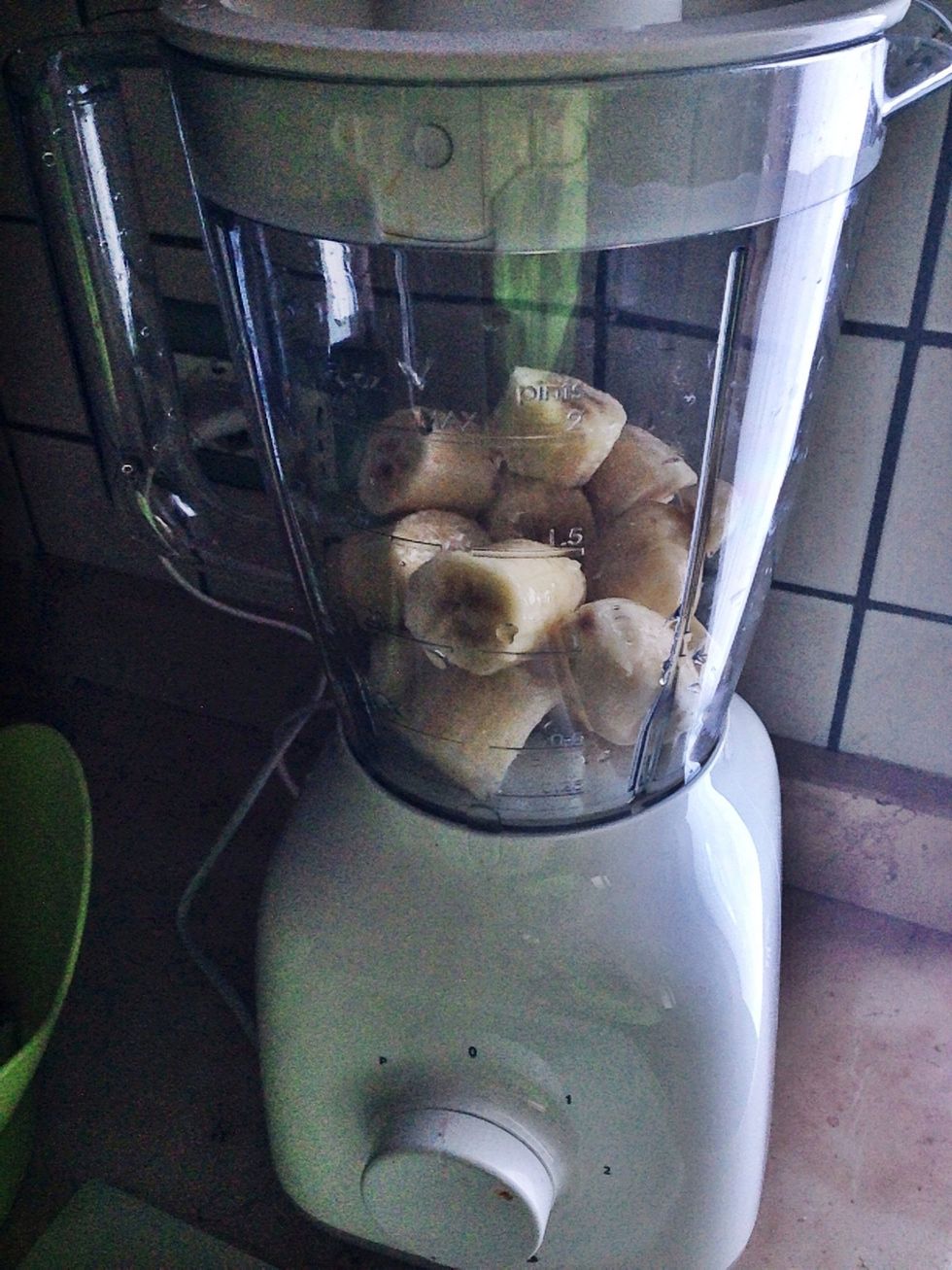 Start blending bananas with roughly 100ml of soy milk. Add water or soy milk to make it smoother if needed but make sure it stays creamy.
