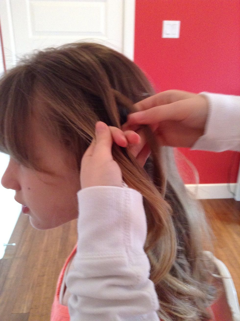 Start braiding by putting the top layer in the middle of the two others...